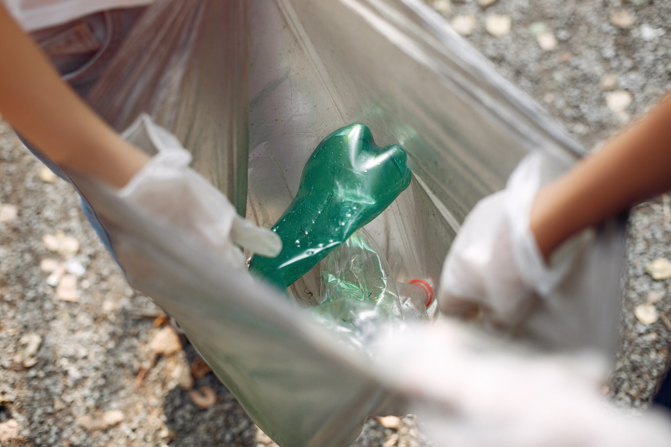 children-collects-garbage-in-garbage-bags-in-park-QKN6GEB